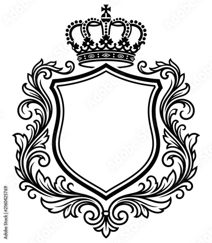Vintage heraldic shield and crest frame template decorated with royal crown and ornate floral scrollwork flourishes