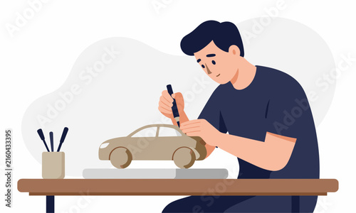 Skilled designer working on a prototype clay or wooden car model at a desk in a creative engineering studio.