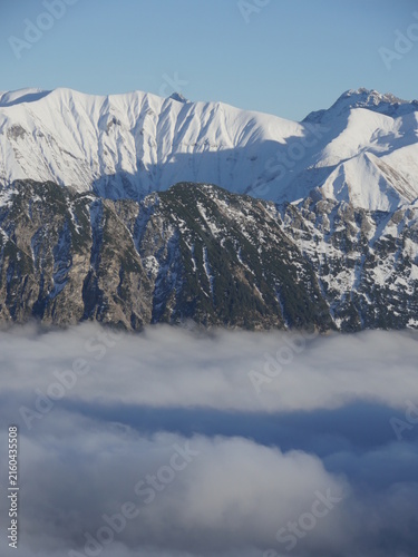 Canvas Print The sky is cloudy and the mountains are covered in snow