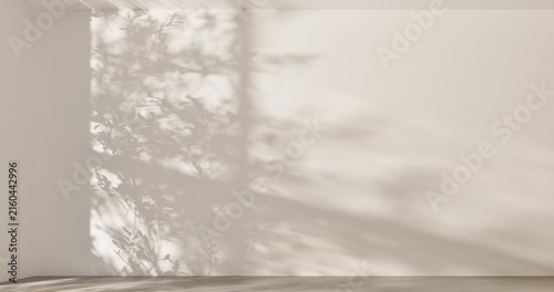Soft sunlight and tree branch shadows on beige wall in empty room with wooden floor, minimal aesthetic background with natural light for product display, mockup and presentation design