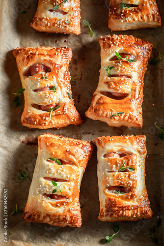 Crispy sausage roll with thyme and sesame seeds.
