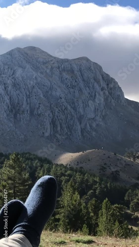 Rugged rocky mountain cliff and steep scree slope in a wild alpine landscape