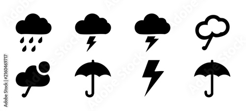 Stormy weather glyph icon collection with black solid clouds lightning bolts and rain protection.
