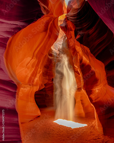 Human Silhouette in Dramatic Sunbeam at Antelope Canyon