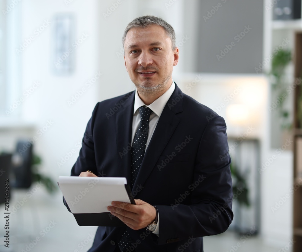Fototapeta premium Portrait of lawyer with clipboard in office