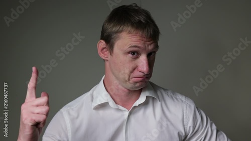 Businessman in a suit looking at the camera. Studio portrait isolated on a white background, suitable for business, stress andal concepts.	Businessman got idea
