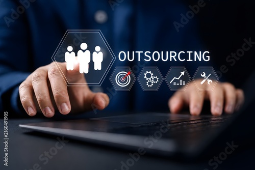 Outsourcing concept, Human resources and global recruitment. Businessman use laptop with outsourcing icon for business working and company.