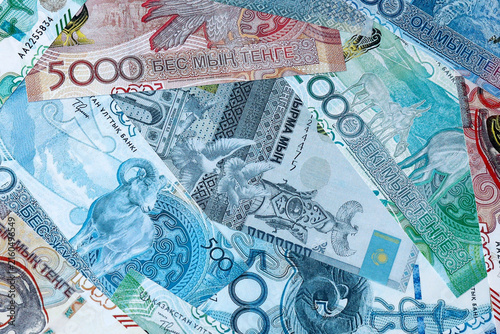 Bild auf Leinwand Kazakhstani tenge money bills in pile on table