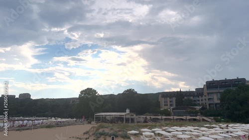 Dramatic storm clouds moving over a seaside resort beach