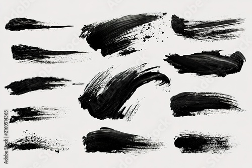 Collection of various black paint brush strokes and ink splatters on white background set of artistic textured design icons.
