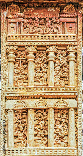 Multi-tiered narrative relief panel depicting palace balconies, courtly life, musicians, dancers, and social gatherings from early Buddhist art on the Sanchi Torana, Sanchi Stupa, India