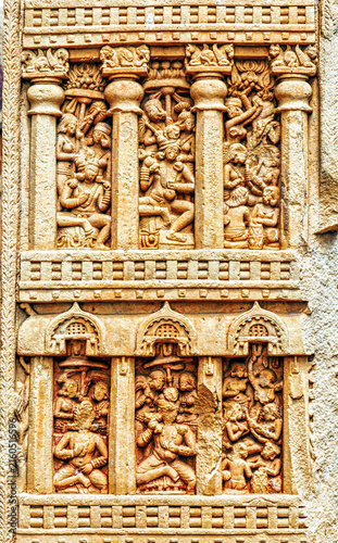 Multi-tiered narrative relief panel depicting palace balconies, courtly life, musicians, dancers, and social gatherings from early Buddhist art on the Sanchi Torana, Sanchi Stupa, India