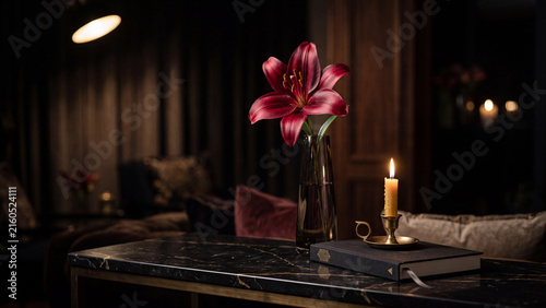 Pink lillies in a vase beside a lit candle on a dark wooden sideboard