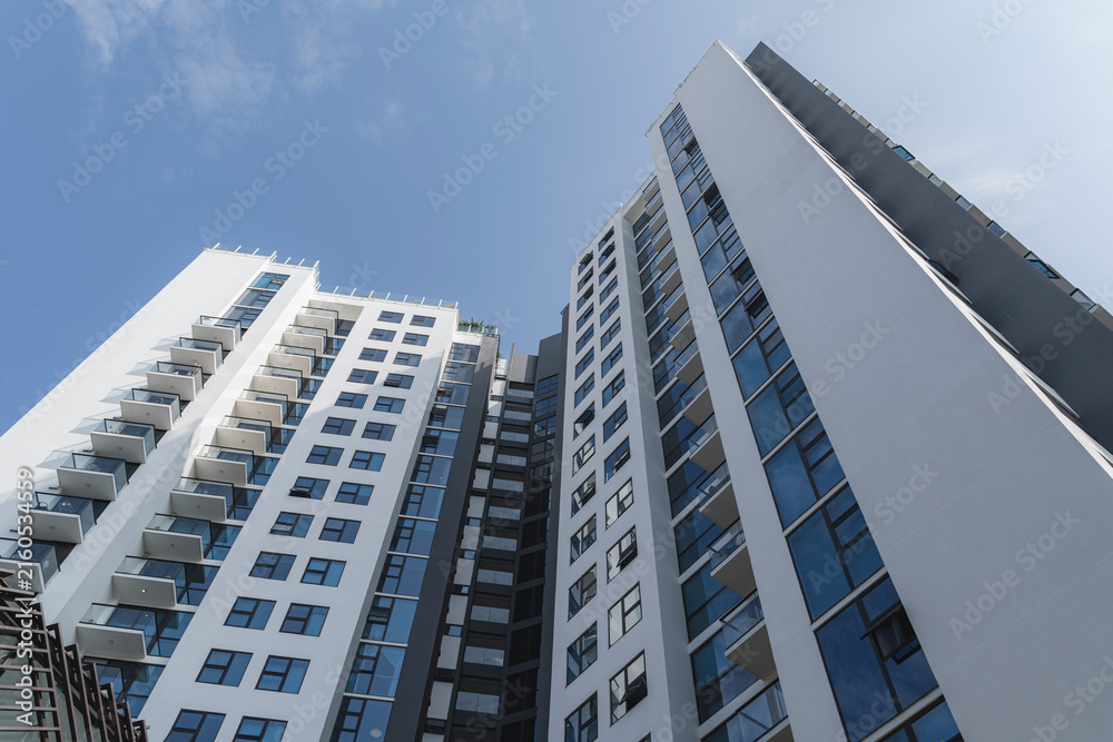 Fototapeta premium Modern high-rise apartment buildings reaching for sky