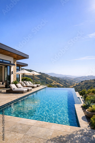 Panoramic view of pool and mountains from luxurious outdoor living area.