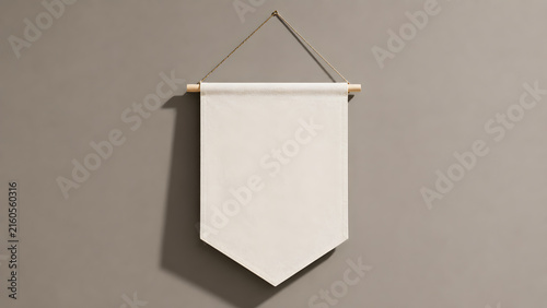 Blank white fabric banner hanging on wooden dowel against gray wall. Minimalist interior decor mockup. Scrolled textile pennant with rope. Ideal for branding.