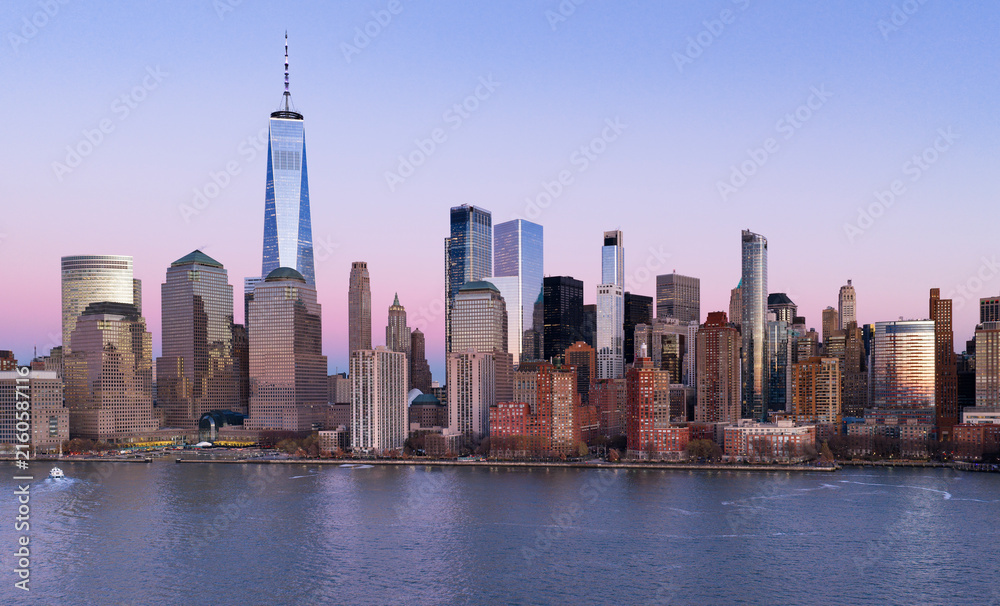 Fototapeta premium New York skyline. NYC skyline with Hudson landscape. Manhattan at night. New York City panoramic skyline. NYC aerial cityscape. New York City downtown at night. New York panoramic cityscape.