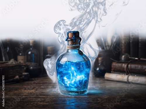 Glowing blue magic potion bottle with swirling smoke on a vintage wooden table