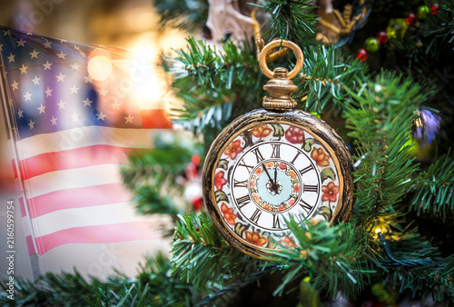Photography Christmas tree decoration with clocks showing five minutes left to new year with