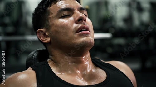 Athlete wiping sweat and catching breath after intense training