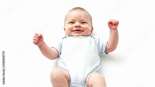 Cheerful baby smiling and stretching arms on clean white background