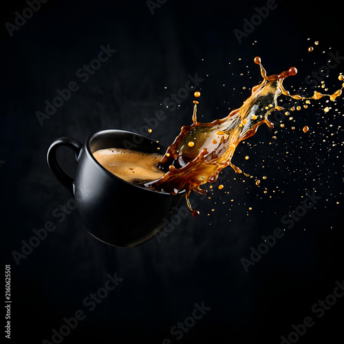 Black Coffee Splash from Cup Dynamic Pouring Liquid Dark Background Action Shot