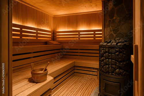 Empty sauna room with wooden benches