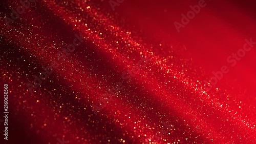 Close up of sparkling red glitter particles creating a festive and vibrant background with shimmering lights