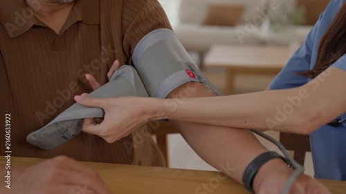 Blood Pressure Measurement for Elderly Man During Medical Examination by Healthcare Professional Using Arm Cuff in Home Clinic Setting for Senior Patient Care and Routine Health Monitoring