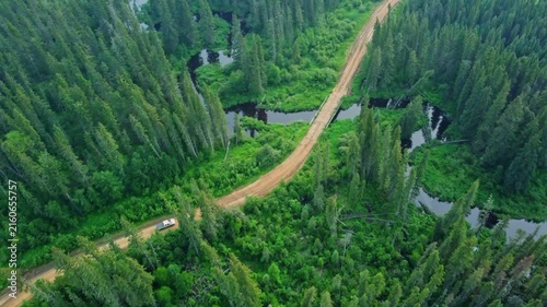 White Pickup Truck Driving on Unpaved Forest Road in Canada