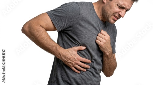 Man clutching his chest and side in pain against white background