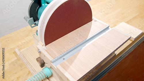 Obraz na plátne Disc sander attachment mounted on a bench grinder for woodworking and metal finishing