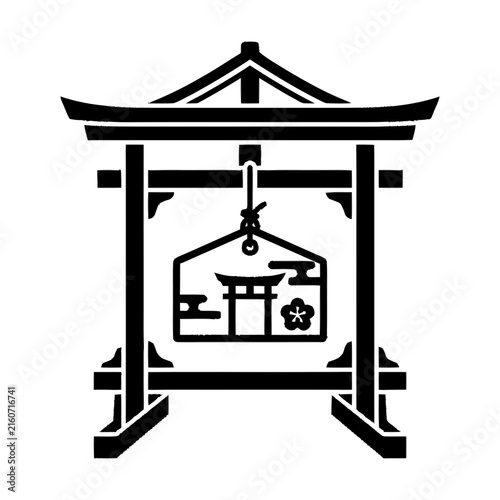 Japanese Ema wooden plaque hangs inside a traditional Shinto frame.