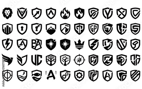 Collection of shield shaped emblems with various symbols dark silhouette style