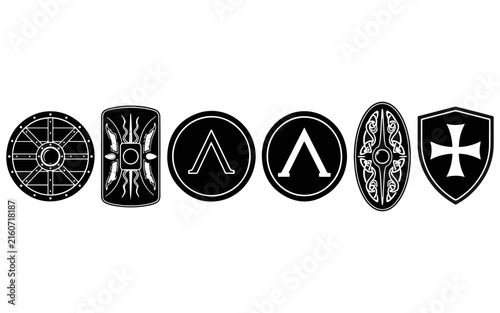 Collection of five shield silhouettes against a black background