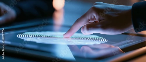 Male employes push sensors to record corporate attendance time and after work using fingerprint scanning.