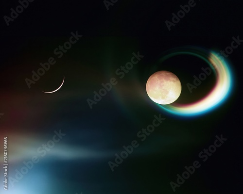 Large warm copper full moon with a glowing teal ring and a thin rose-gold crescent moon on a dark charcoal background for spiritual branding and copy space