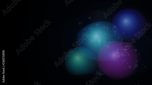 Dark abstract background features three luminous, softly glowing spheres in blue, turquoise, and purple hues with sparkling light effects, creating a mystical atmosphere.