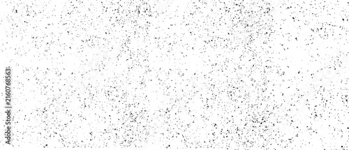 Fotografía Sparse black distressed speckle texture on white background with scattered grung