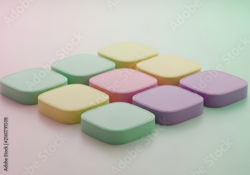 A group of colorful square mints arranged in a pattern on a light background