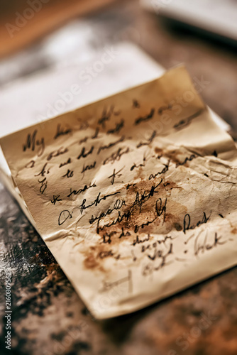 Crumpled Handwritten Note with Coffee Stain