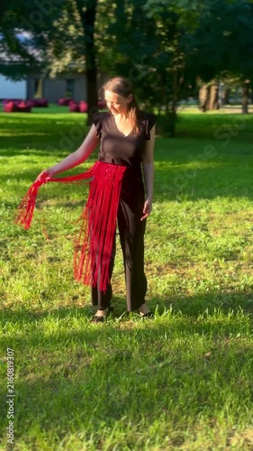 Woman wearing a stylish handmade red macrame belt