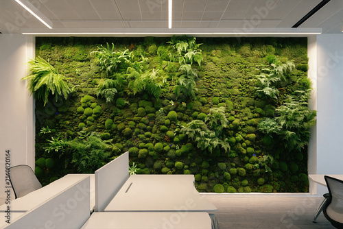 Green moss wall vertical garden in modern office interior