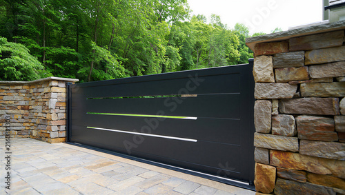 Fotografie Minimalist black metal sliding entry gate with horizontal design driveway entran