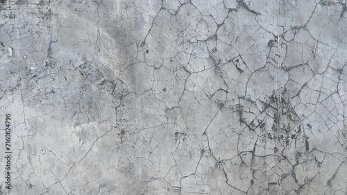 Texture concrete wall of light grey color cement texture background.Grey pastel rough crack cement texture stone concrete,rock plastered stucco wall; painted flat fade background. Side view. close up.