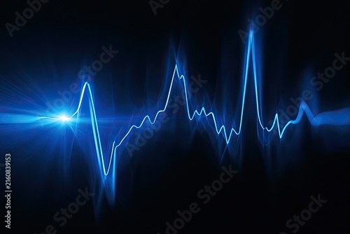 Abstract pulsating blue energy wave against a dark background