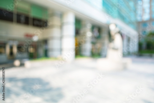 Canvas Print Abstract blurred modern urban office plaza background with building frontage and