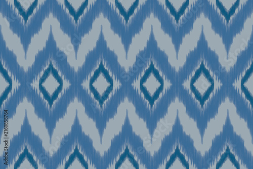 Seamless Ethnic Ikat Geometric Pattern Design with Chevron Zig-Zag and Diamond Motifs in Shades of Blue