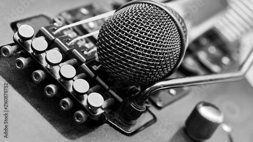Sticker Music.Vocal microphone on body of an electric guitar