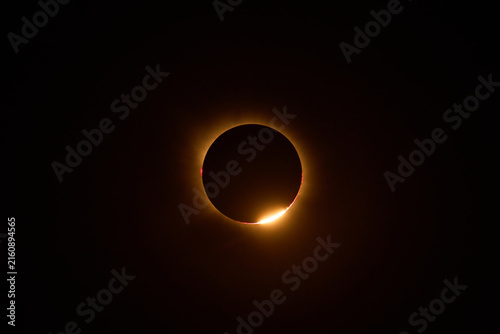 Solar eclipse diamond ring effect in dark sky and Baily's pearls